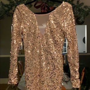 Gold sequin mini dress with a mesh v cut!